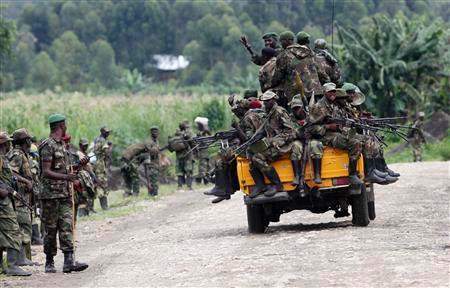 File Photo: M23 rebel fighters sit on a truck as they withdraw near the town of Sake, 42 km (26 miles) west of Goma in eastern Congo November 30, 2012. REUTERSpix