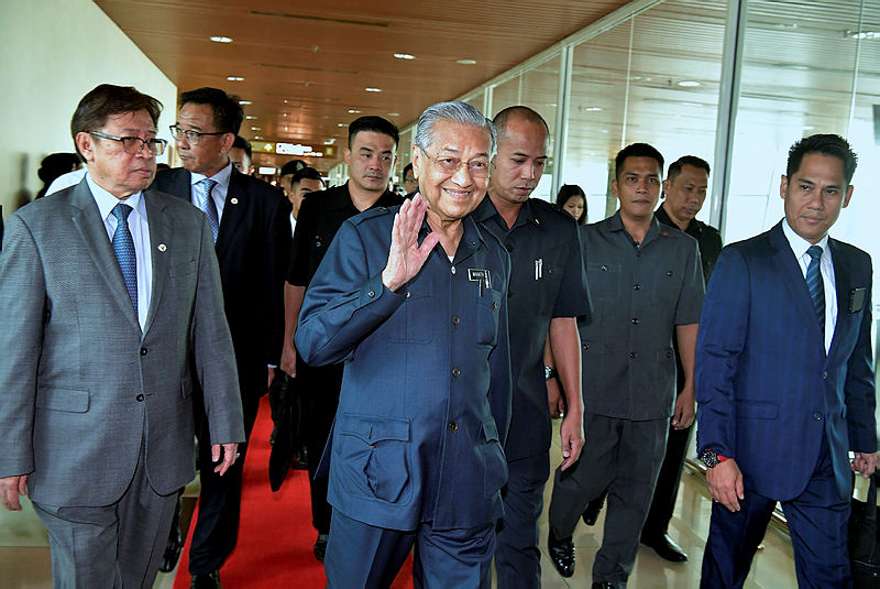 Prime Minister Tun Dr Mahathir Mohamad waves to the media, following arrival at the Kota Kinabalu International Airport, on Sept 17, 2019. — Bernama