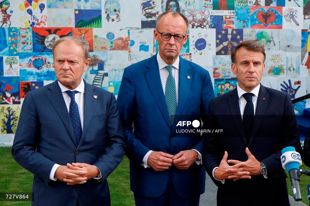 (FILES) (From L) Poland's Prime Minister Donald Tusk, Germany's Chancellor Friedrich Merz and France's President Emmanuel Macron. - Ludovic MARIN / AFP