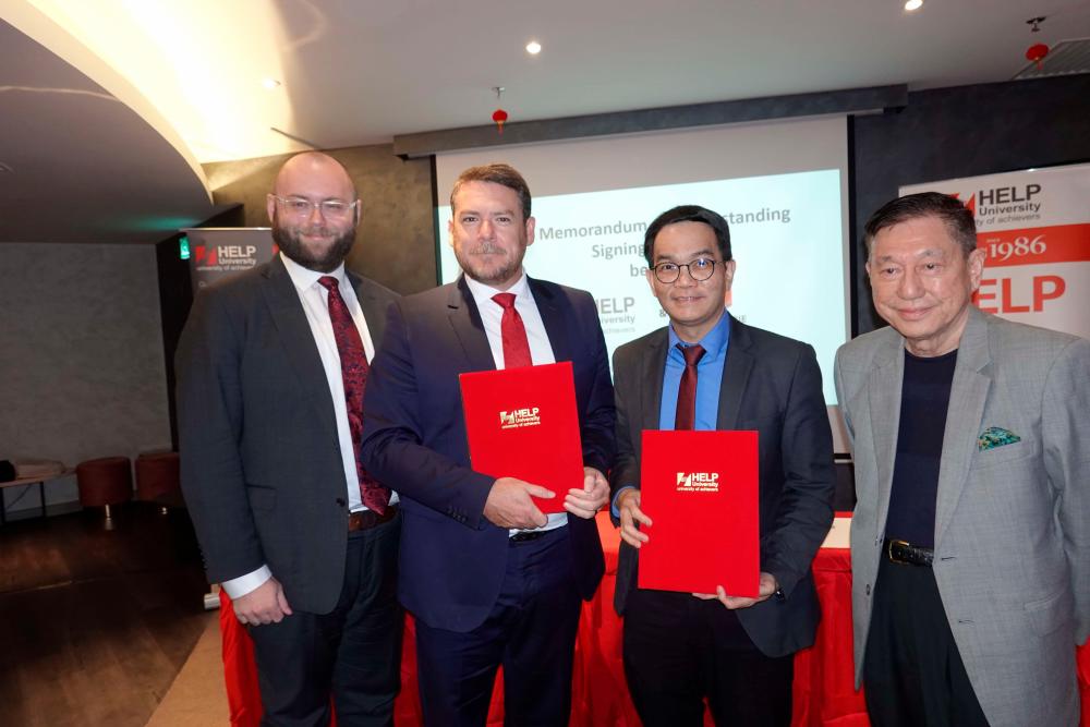 (From left) Chief Operating Officer, Eckermann and Bushby, both from Macquarie University, Professor Dr Liew and Paul Chan, Chancellor of HELP University