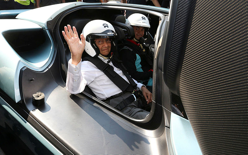 Prime Minister Tun Dr Mahathir Mohamad (L) was taken for a spin on the NIO EP9 by Malaysian race car driver Jazeman Jaafar (R), on March 17, 2019. — Bernama