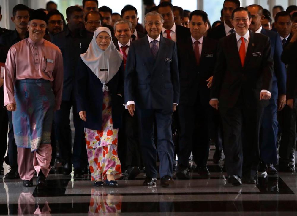 Prime Minister Tun Dr Mahathir Mohamad (C) flanked by Deputy Finance Minister Datuk Amiruddin Hamzah (L), Deputy Prime Minister, Datuk Seri Dr Wan Azizah Wan Ismail (2nd L), and Finance Minister Lim Guan Eng (R), arrive for the tabling of the 2020 Budget at the Parliament, on Oct 11, 2019. — Sunpix by Norman Hiu