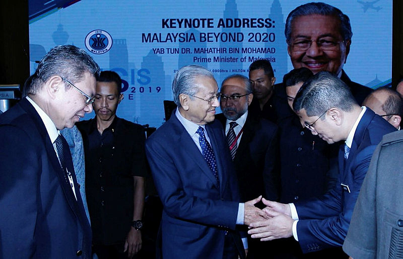 Prime Minister Tun Dr Mahathir Mohamad (2nd L) is greeted by guests at the Strategic and International Studies (Isis) Praxis Conference 2019, on Oct 21, 2019. — Sunpix by Zulkifli Ersal