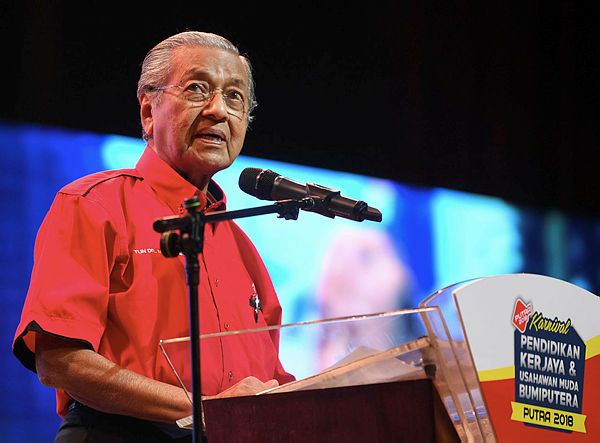 Prime Minister Tun Dr Mahathir Mohamad speaks at the launch of the Bumiputera Education and Entrepreneurship Carnival 2018 at Dewan Agung Tuanku Canselor, UiTM on Dec 9, 2018. — Bernama