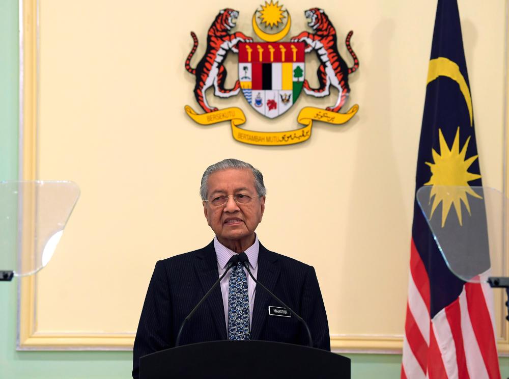 Prime Minister Tun Dr Mahathir Mohamad delivers a speech at the launch of myPortfolio at the Perdana Putra Building today. - Bernama