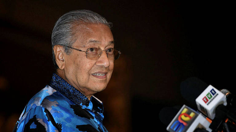 Tun engages audience with wit and humour during Cambridge talk