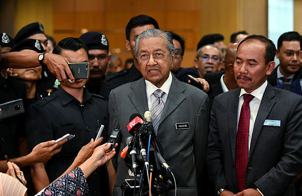Prime Minister Tun Dr Mahathir Mohamad speaks to the media after attending a closed briefing with the leaders of statutory bodies in Putrajaya on Jan 28, 2019. — Bernama