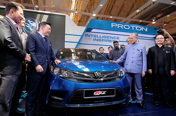 Prime Minister Tun Dr Mahathir Mohamad (2nd from R) launches the Proton Iriz 2019 edition at the launch of Malaysia Autoshow 2019 at MAEPS, Serdang on April 11, 2019. — Bernama