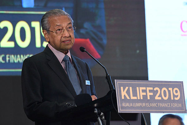 Prime Minister Tun Dr Mahathir Mohamad addresses the opening of the 15th Kuala Lumpur Islamic Finance Forum at a hotel in Kuala Lumpur on April 10, 2019. — Bernama