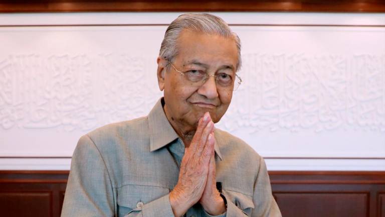Tun Dr Mahathir Mohamad gestures after an interview with Reuters in Kuala Lumpur, on March 13, 2020. — Reuters