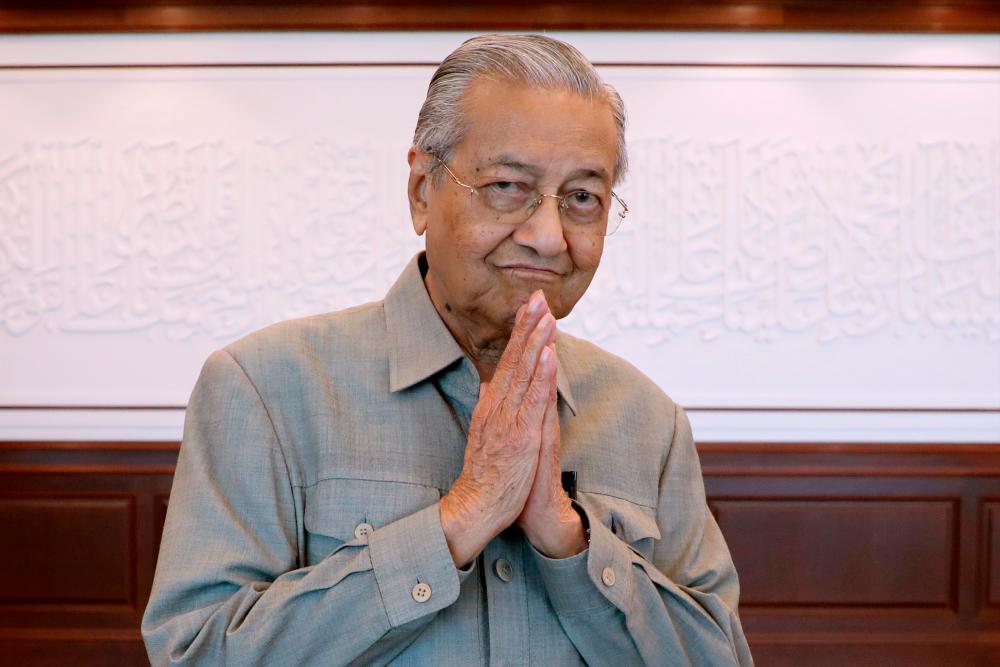 Tun Dr Mahathir Mohamad gestures after an interview with Reuters in Kuala Lumpur, Malaysia, March 13, 2020. — Reuters