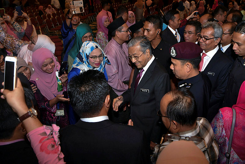 Prime Minister Tun Dr Mahathir Mohamad is greeted by civil servants, upon arrival for a gathering, on June 10, 2019. — Bernama