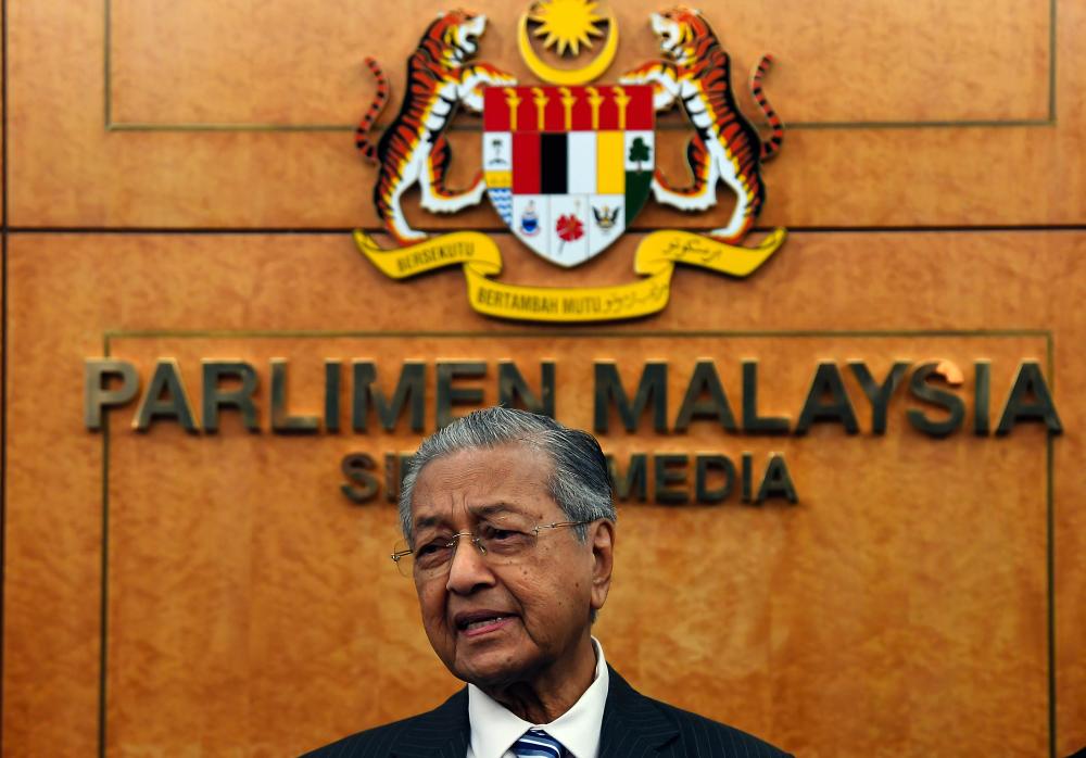 Prime Minister Tun Dr Mahathir Mohamad speaks to the media during the 14th parliamentary session. - Bernama