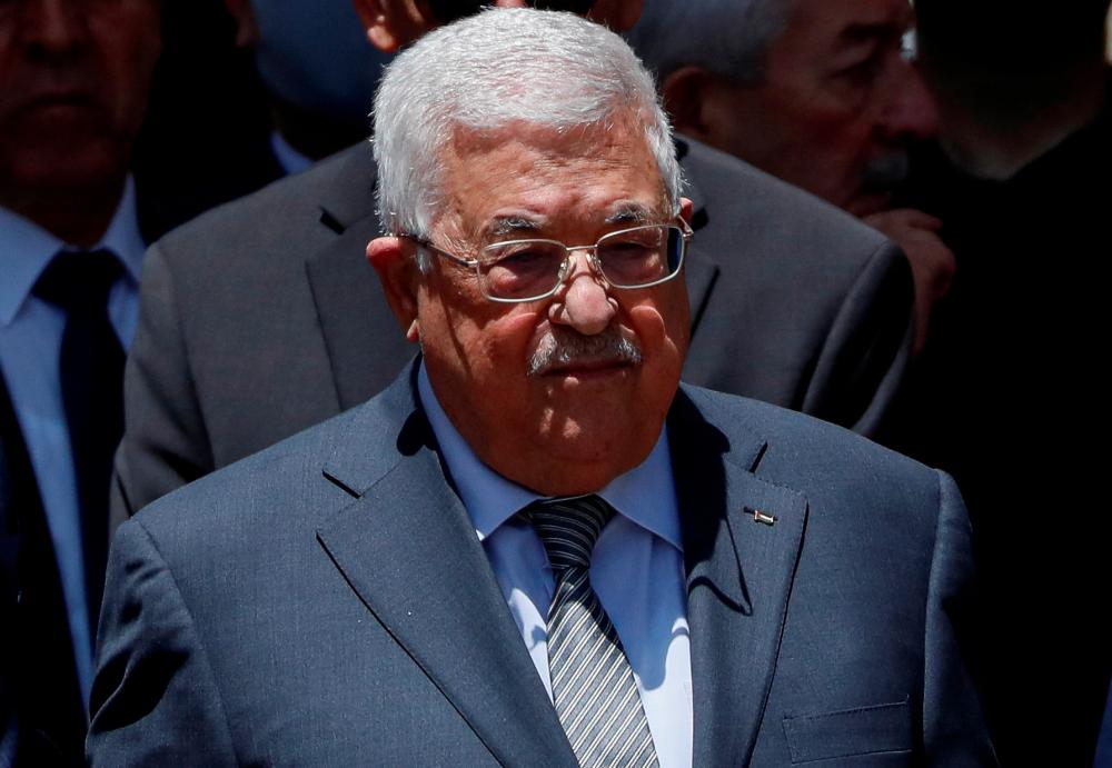 Palestinian President Mahmoud Abbas bids farewell to Al Jazeera journalist Shireen Abu Akleh, who was killed during an Israeli raid, in Ramallah in the Israeli-occupied West Bank May 12, 2022. REUTERSpix