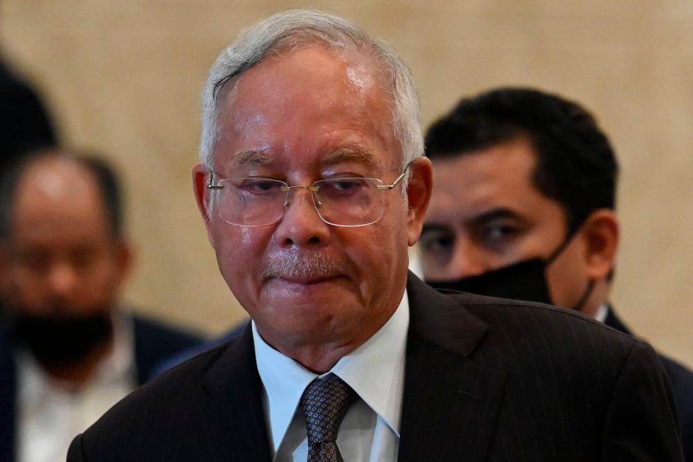 Malaysia's former prime minister Najib Razak reacts during a press conference at the federal court in Putrajaya on August 18, 2022. AFPPIX