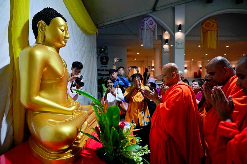 Wesak day or the Buddha Day marks the birth of Gautama Buddha, his attaining of enlightenment - AFPpix