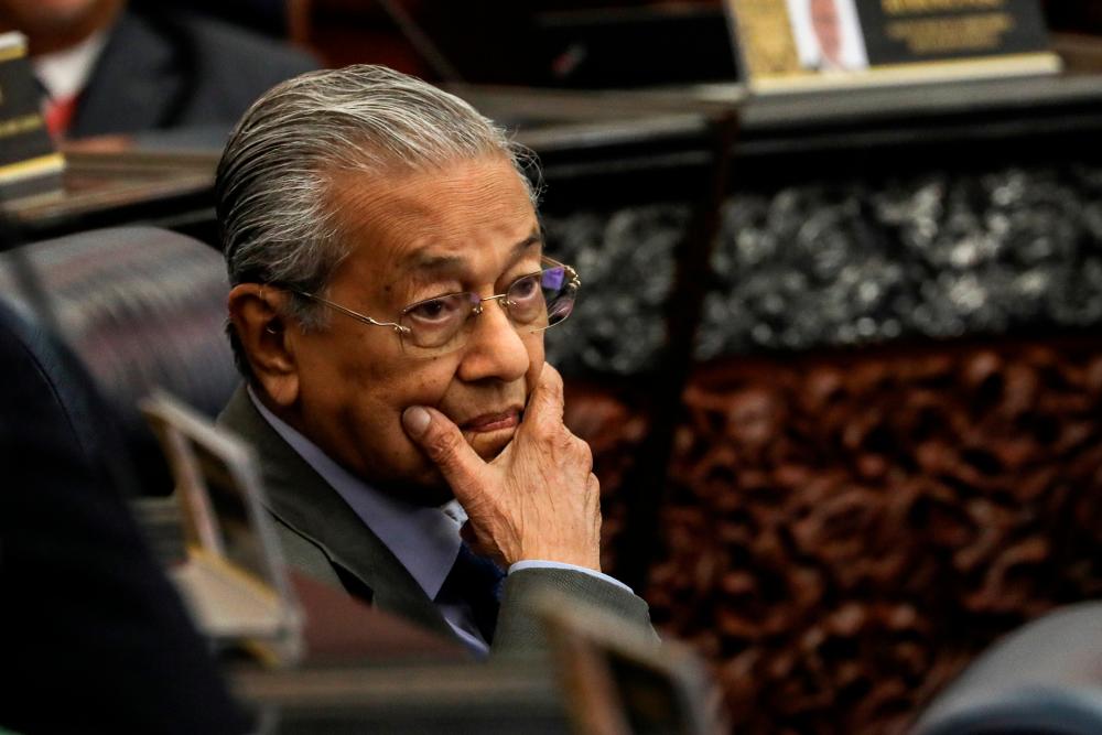 Former Prime Minister Tun Dr Mahathir Mohamad reacts during a session of the Dewan Rakyat, on July 13, 2020. - Reuters
