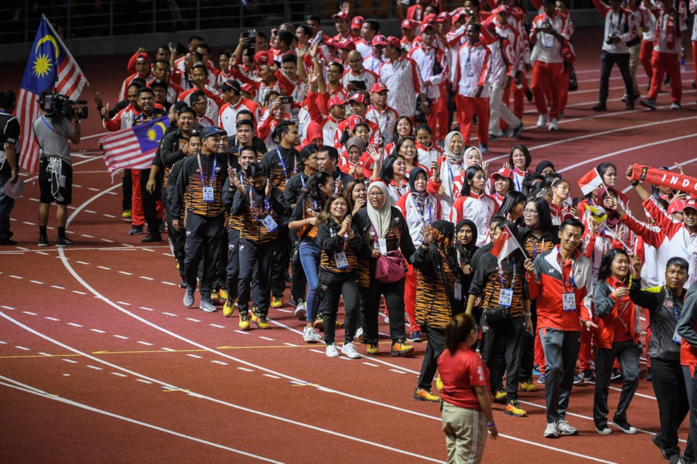 The Malaysian contingent parading at the New Clark City Athletics Stadium as the 30th SEA Games in the Philippines drew to a close on Dec 11. — Bernama