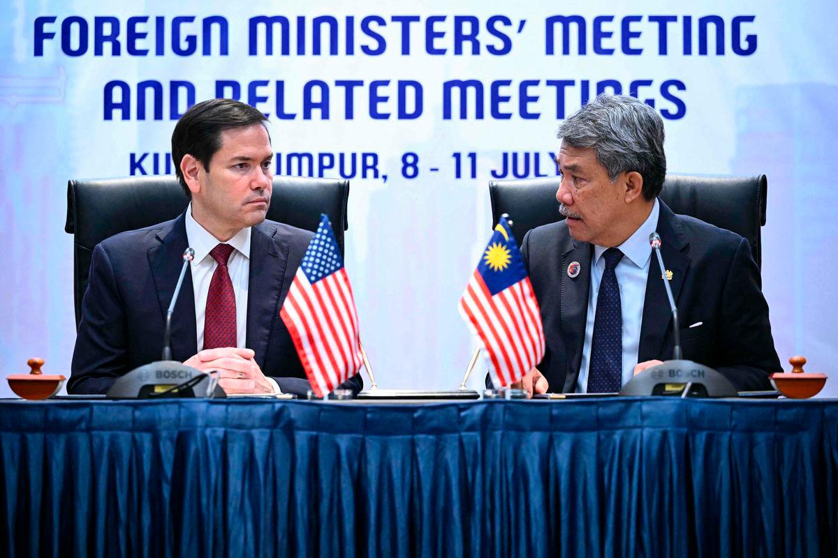 US Secretary of State Marco Rubio takes part in a memorandum of understanding signing with Malaysia’s Minister of Foreign Affairs Mohamad Hasan during the 58th Association of Southeast Asian Nations (ASEAN) Foreign Ministers’ meeting and related meetings at the Convention Centre in Kuala Lumpur on July 10, 2025. (Photo by Mandel NGAN / POOL / AFP)