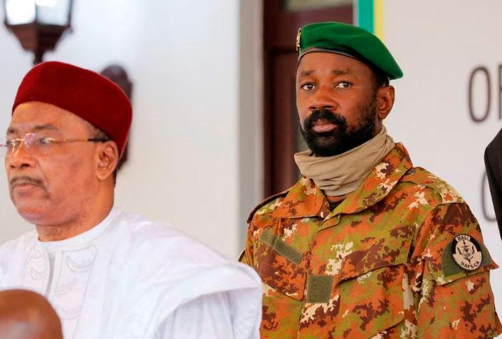 Colonel Assimi Goita, leader of Malian military junta, looks on while he stands behind Niger’s President Mahamadou Issoufou during a photo opportunity after the Economic Community of West African States (ECOWAS) consultative meeting in Accra, Ghana September 15, 2020. REUTERSPIX