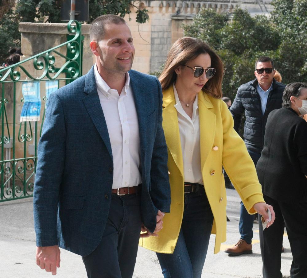 Malta’s Prime Minister Robert Abela and his wife Lydia Abela arrive at a polling station in Marsascala on March 26, 2022 during the country’s general election. AFPPIX