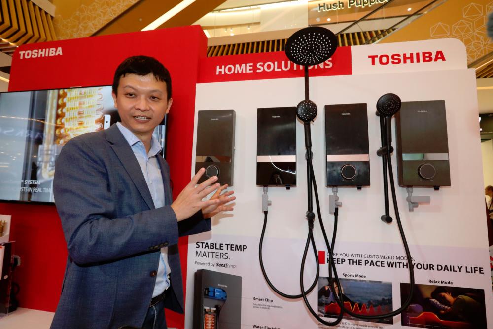 Toshiba Sales &amp; Services Sdn Bhd managing director Steven Yang presenting the new Toshiba SensTemp stable temperature water heater models to the audience during the launch, recently.