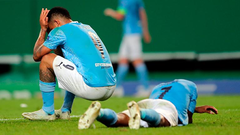 Manchester City’s Gabriel Jesus (left) and Raheem Sterling of react after the UEFA Champions League quarterfinal match against Olympique Lyon in Lisbon. – EPAPIX
