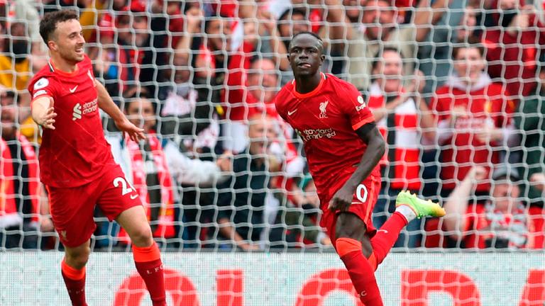 Liverpool’s Sadio Mane (right) celebrates scoring their second goal with Diogo Jota during their English Premier League match against Burnley at Anfield. – REUTERSPIX