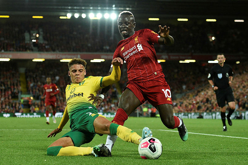 Norwich City’s English defender Max Aarons (L) vies with Liverpool’s Senegalese striker Sadio Mane during the English Premier League football match between Liverpool and Norwich City at Anfield in Liverpool, north west England on Aug 9, 2019. — AFP