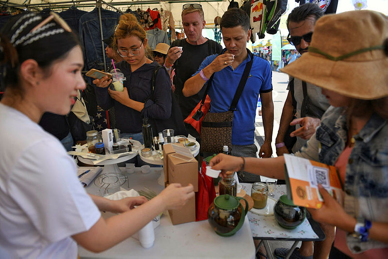 People try cannabis-infused teas during the second day of the inaugural Pan Ram weed festival in the Thai northeastern province of Buriram on April 20, 2019. — AFP