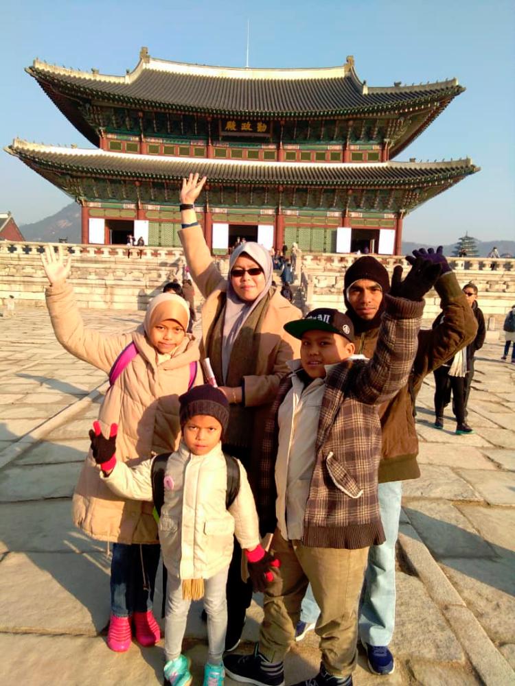 Mardiyah (wearing sunglasses) with her husband and children in Seoul.