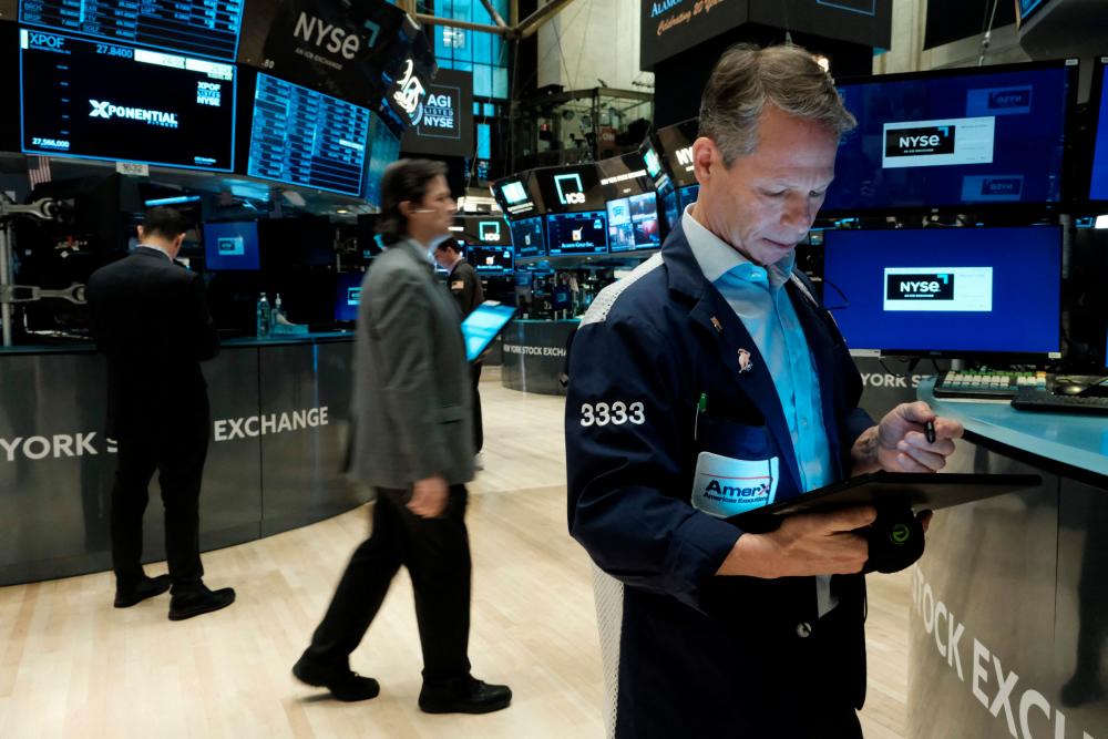 Traders working on the floor of the New York Stock Exchange on Wednesday, Feb 8. – AFPpic