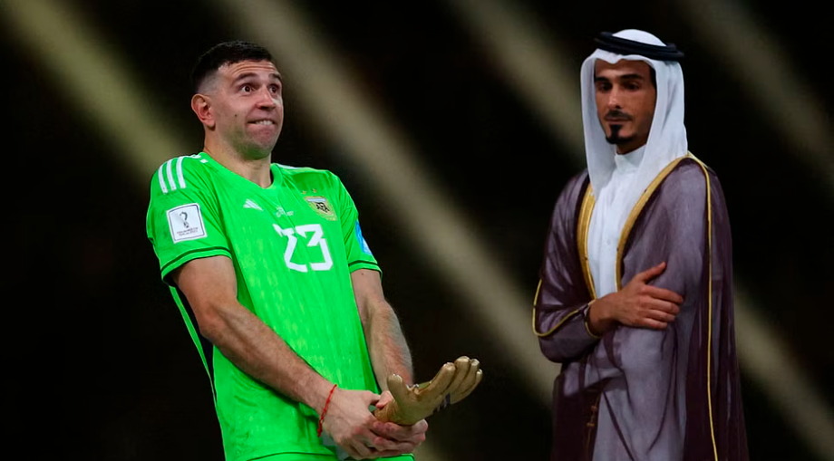 Football - FIFA World Cup Qatar 2022 - Final - Argentina v France - Lusail Stadium, Lusail, Qatar - December 18, 2022 Argentina’s Emiliano Martinez reacts after receiving the Golden Glove award after the match REUTERSPIX