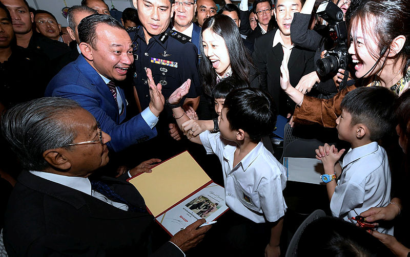 Education Minister Dr Maszlee Malik gives the high-five to a student at the national level 2019 Teachers’ Day celebrations, on May 16, 2019. — Bernama