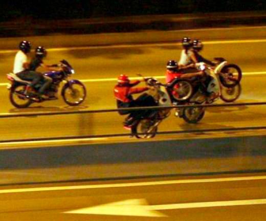 Illegal racing motorcyclists or popularly known as ‘Mat rempit’ in Malaysia, grazing the streets, dangering the lives of other road users.
