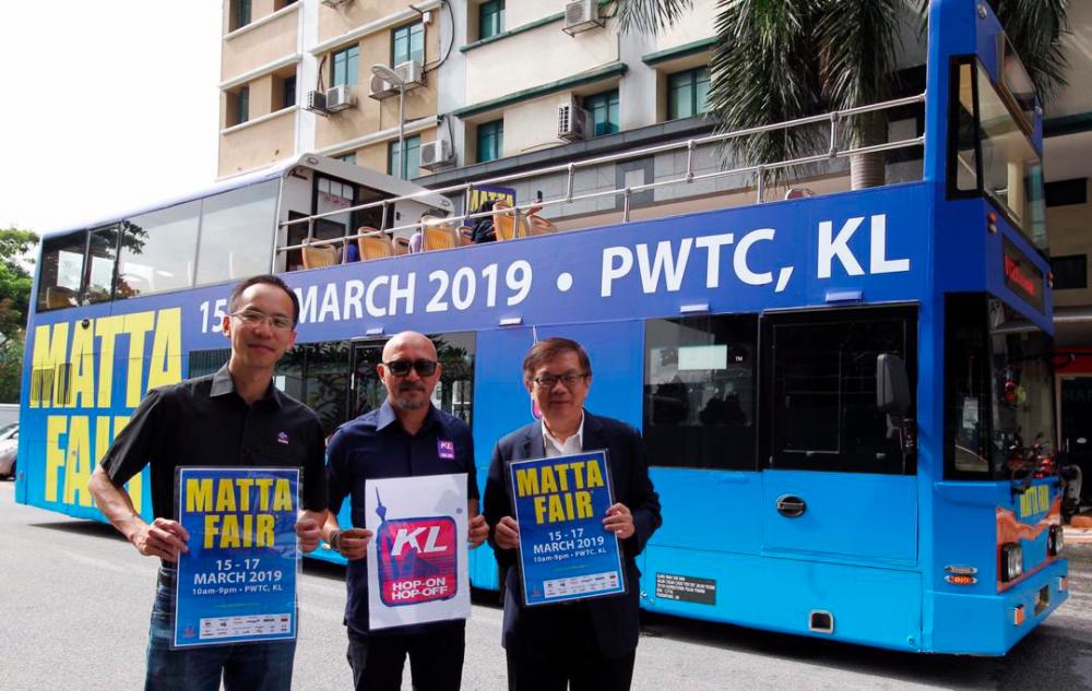 From left: Matta Secretary General Nigel Wong, Group Managing Director of Elang Wah Holdings Sdn Bhd Syed Azhar Syed Nadzir, and Matta CEO Phua Tai Neng, pose for a photo, with the KL Hop-On Hop-Off bus, on Jan 30, 2019. — Sunpix by Zulkifli Ersal
