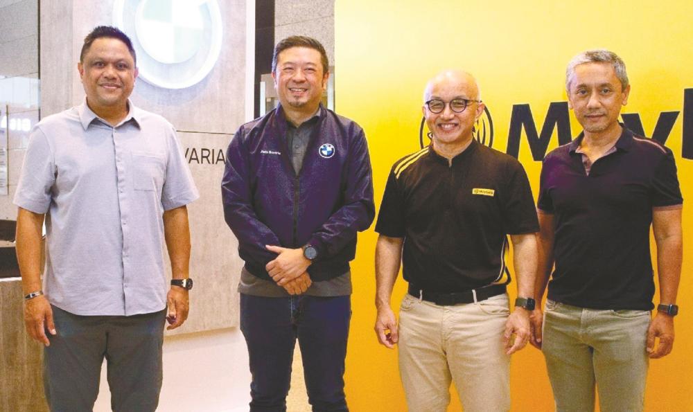 From left: Maybank chief sustainability officer Shahril Azuar Jimin, Sime Darby Auto Bavaria managing director Thim Juan Vi, Chong and Etiqa Insurance and Takaful Group CEO Kamaludin Ahmad at the Maybank EV driving experience event.