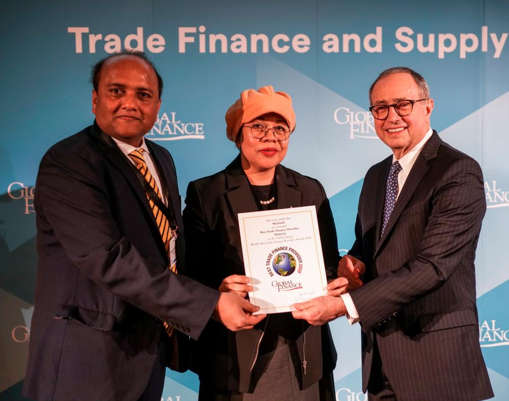From left: Maybank London head of financial institutions &amp; transaction banking UK Muhammad Saleem and general manager Mazlina Muhammad, receiving the Best Trade Finance Provider in Malaysia award from Global Finance publisher and editorial director Joseph Giarraputo during the Bankers Association for Finance &amp; Trade (BAFT) Global Annual Meeting in Frankfurt recently.