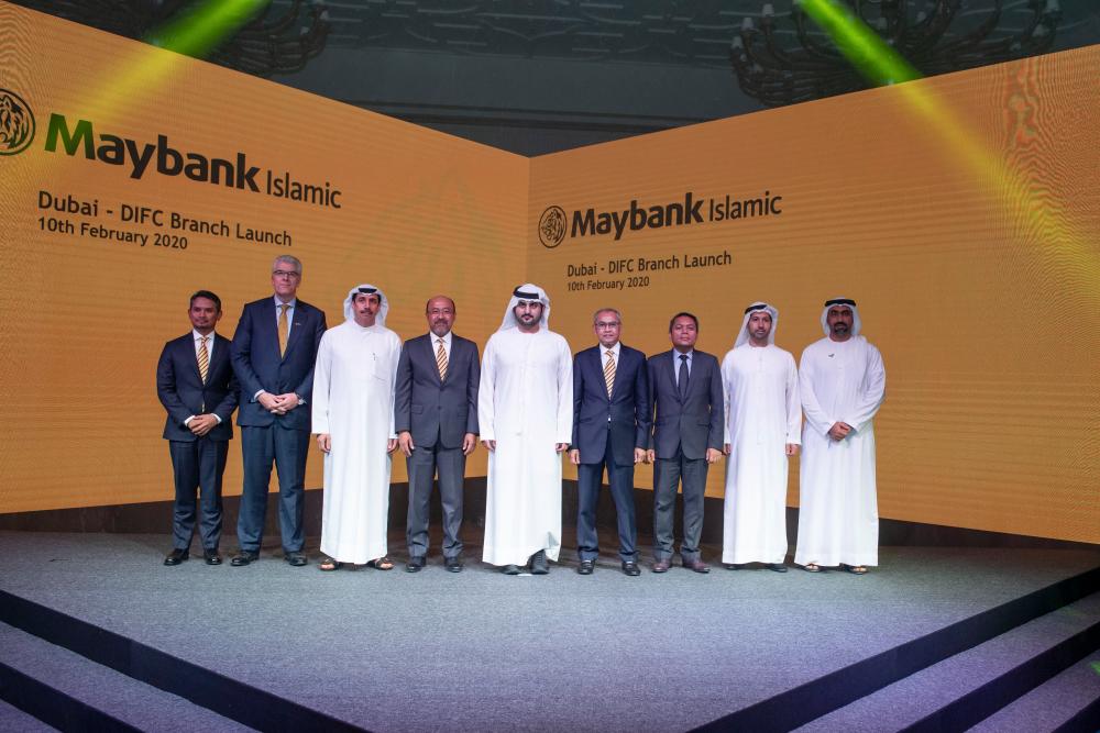 Mohammed Rafique (fourth from left), Dubai deputy ruler and DIFC president Sheikh Maktoum Mohammed, Maybank Islamic chairman Zainal Abidin Jamal and Malaysian ambassador to the UAE Mohd Tarid Sufian with other guests at the branch launch ceremony.