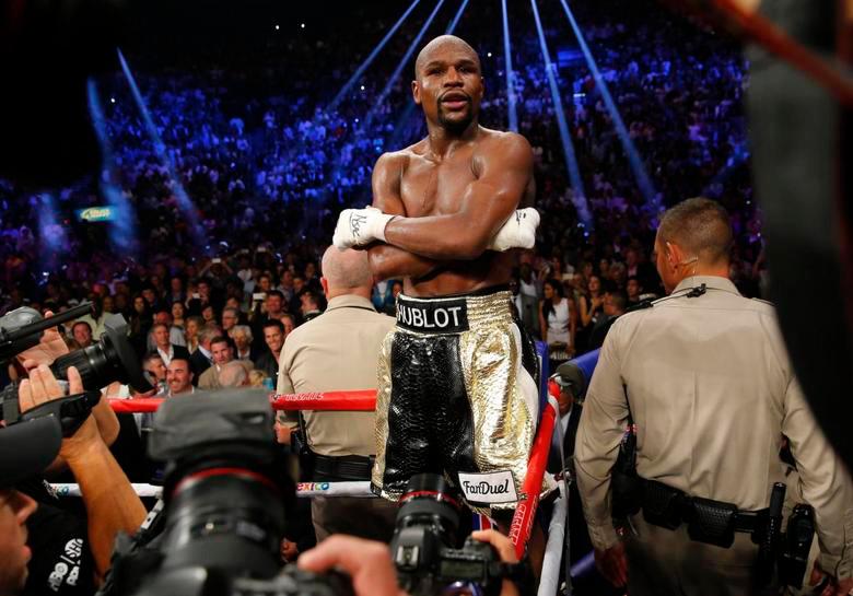 FILE PHOTO: Floyd Mayweather, Jr. stands up on the ropes in his corner after defeating Manny Pacquiao. REUTERSPIX