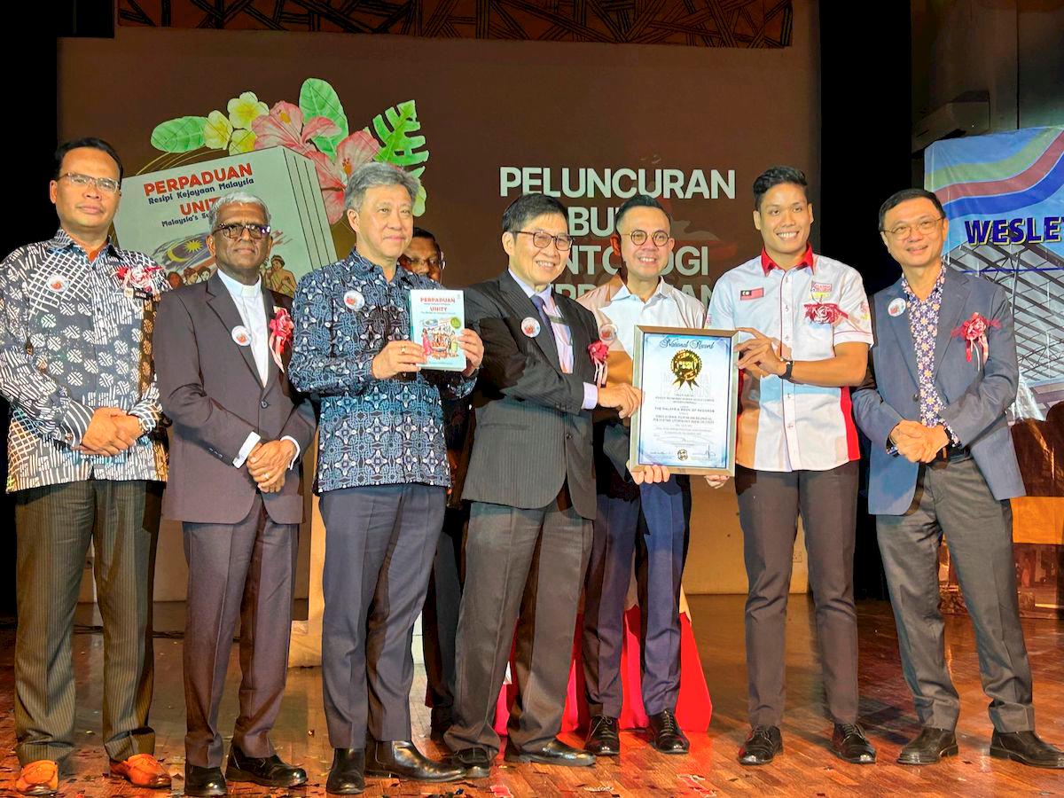 $!WMSKLI representatives receiving the official Malaysia Book of Records certificate on stage during the celebration event