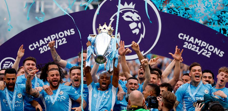 Manchester City’s Fernandinho (centre) lifts the trophy with teammates after winning the Premier League. – REUTERSPIX