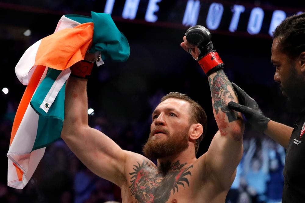 Conor McGregor celebrates after defeating Donald Cerrone in a welterweight bout during UFC246 at T-Mobile Arena on January 18, 2020 in Las Vegas, Nevada. - AFP