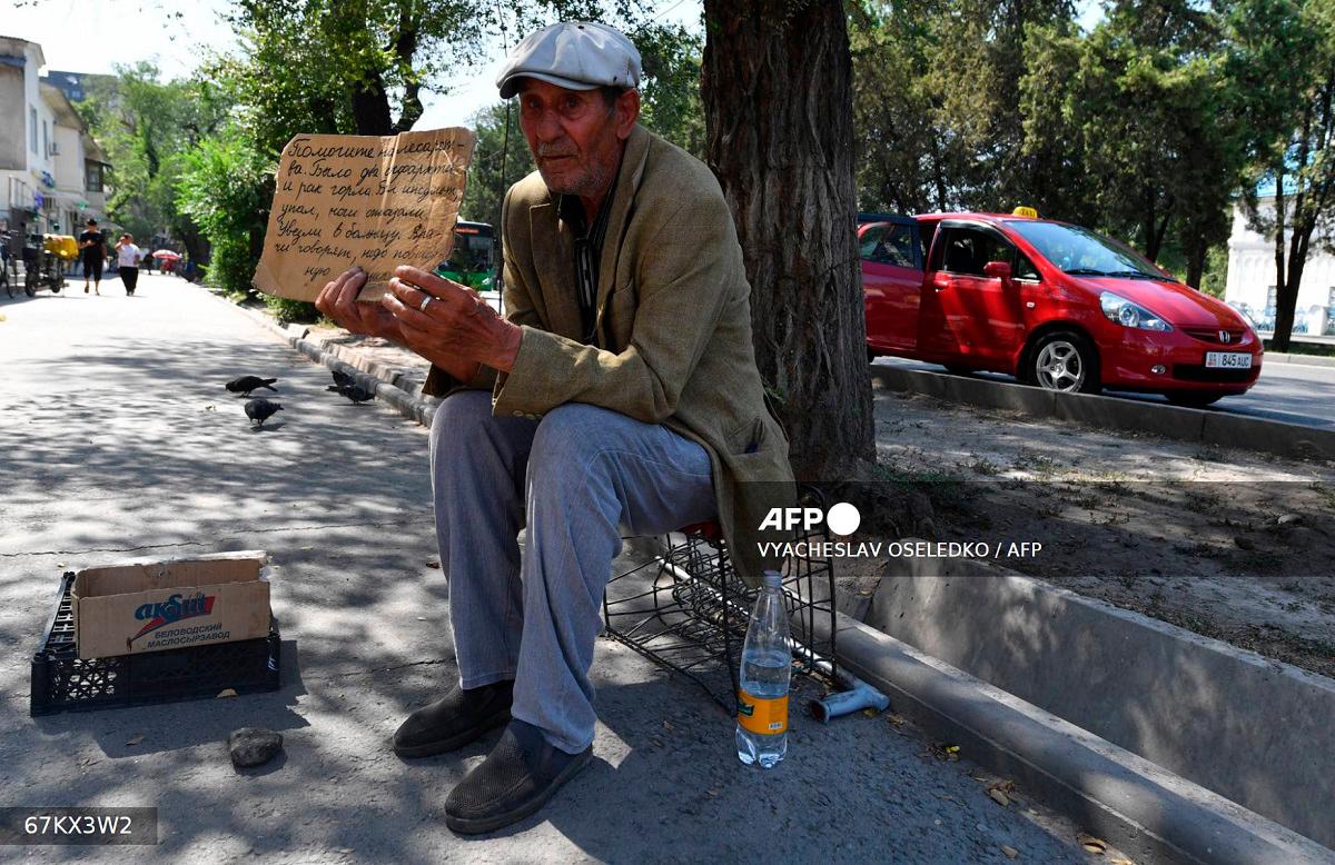 A man asks for donation for medicines in Bishkek, on July 23, 2025. Like many people affected by serious illness in ex-Soviet Central Asia, Almagul Ibrayeva is having trouble finding medicine in her native Kyrgyzstan. The shortages, the high prices and the poor quality of medicine affect many of the region's 80 million inhabitants. - VYACHESLAV OSELEDKO / AFP