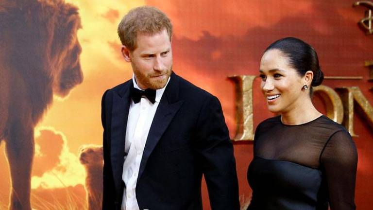 Prince Harry and Meghan Markle attend the premier of The Lion King in London.