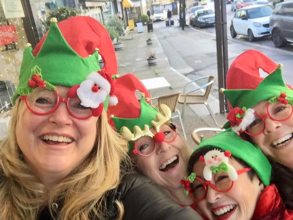Melanie (second from right) and her band of hot-mama besties having a laugh in their 2017 Christmas accoutrements.