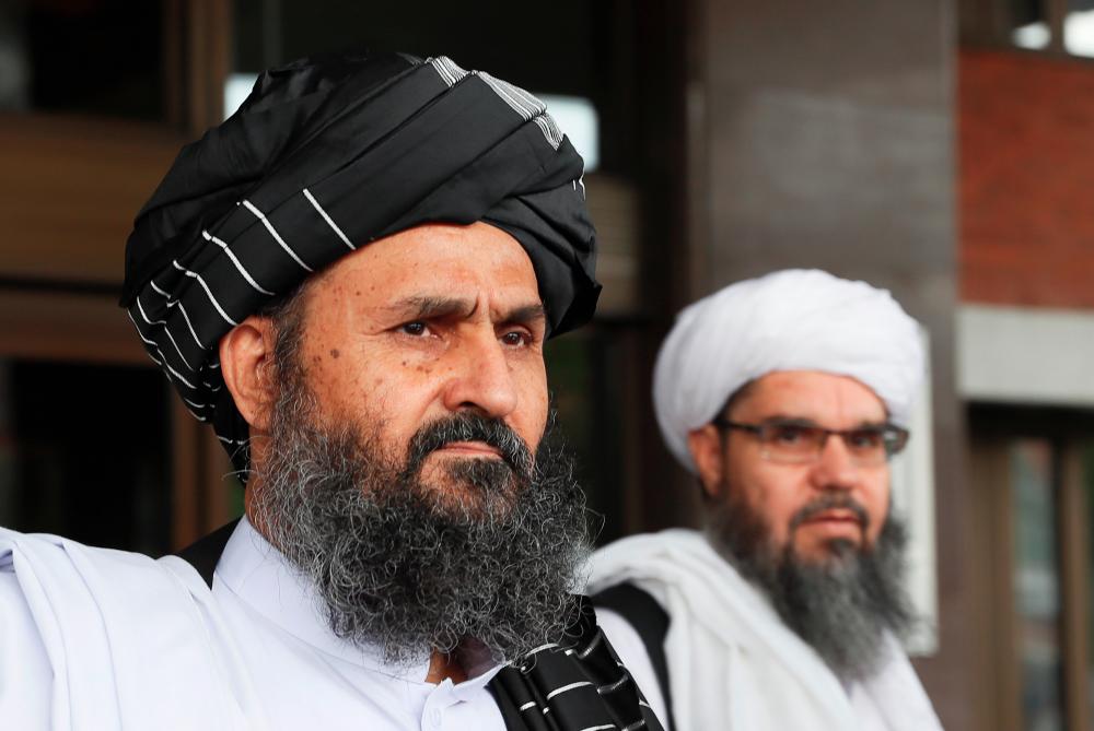 Taliban chief negotiator Mullah Abdul Ghani Baradar (front) leaves after peace talks with Afghan senior politicians in Moscow, Russia May 30, 2019. - Reuters