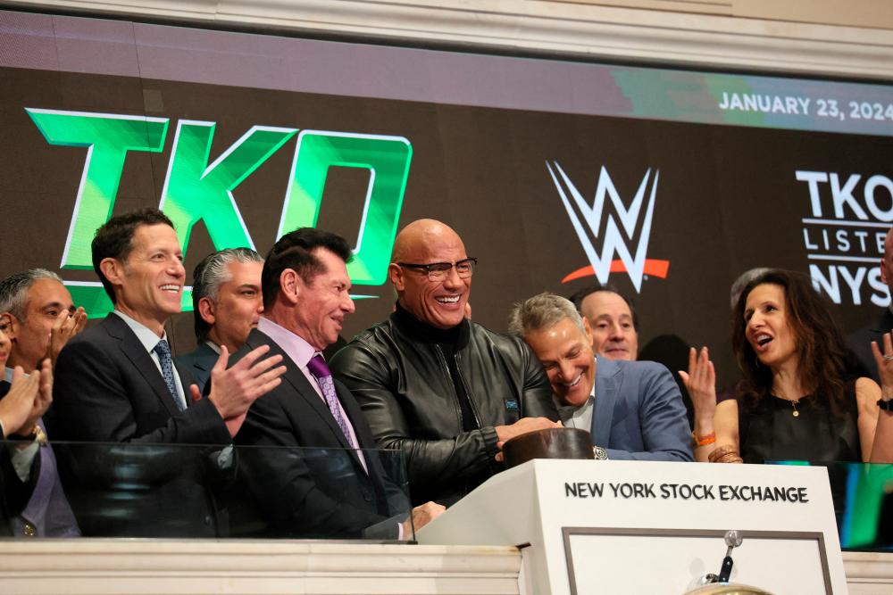 Dwayne ‘The Rock’ Johnson, TKO CEO Ari Emanuel, TKO executive chairman Vince McMahon and other members of the board of TKO ring the opening bell at the New York Stock Exchange on Tuesday. – Reuterspic