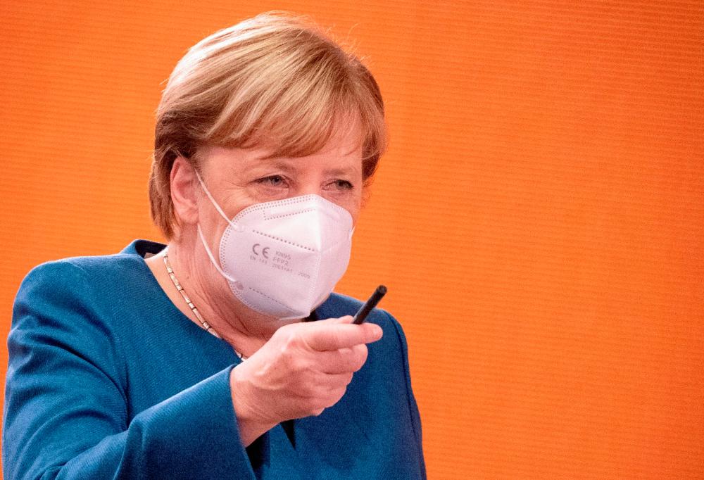 German Chancellor Angela Merkel gestures during the weekly cabinet meeting in Berlin, Germany, October 28, 2020. — Reuters