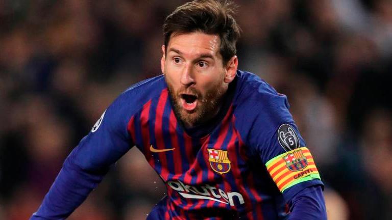 Messi double leads Barca to nail-biting win over Valencia